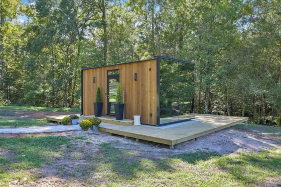 Cuadro de acero impermeable Casa de vidrio Salones de sol con vidrio transparente y puerta doble corredera